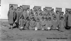 Schoolgirls in front of 3rd residential school Onion Lake, Saskatchewan