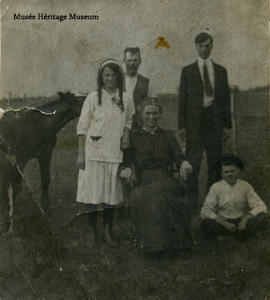 McDonald family in farmyard