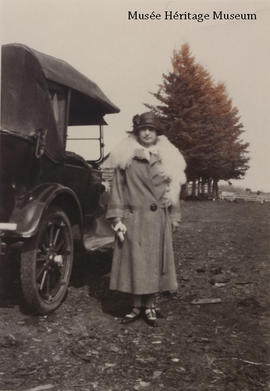 Aurore Gagne standing beside a car